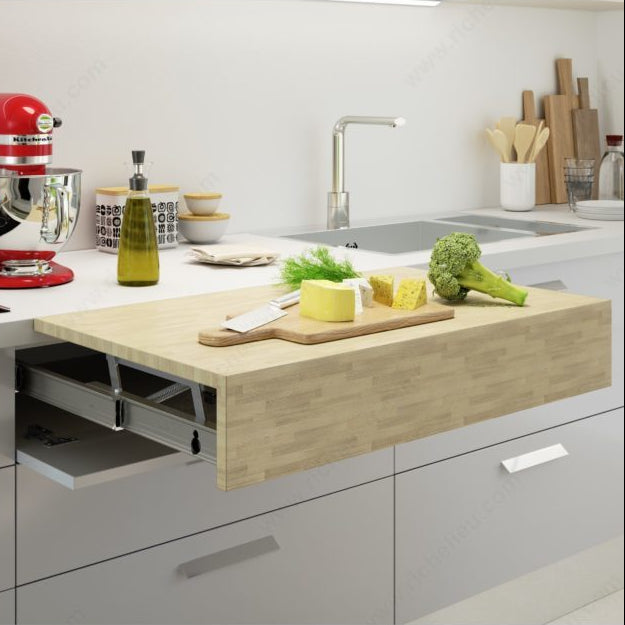 Modern kitchen with a red mixer, cutting board with vegetables, and a pull-out wooden countertop.