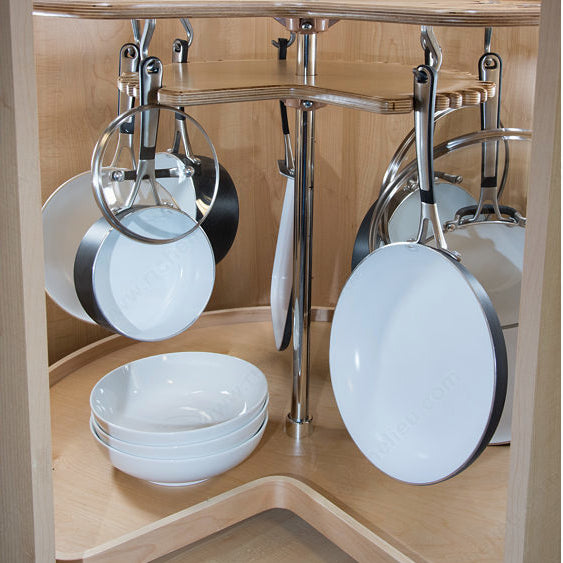Corner kitchen cabinet with hanging pots and pans and stacked bowls.